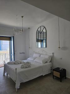 Rúm í herbergi á Terra Muronis Hotel Diffuso