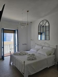 A bed or beds in a room at Terra Muronis Hotel Diffuso