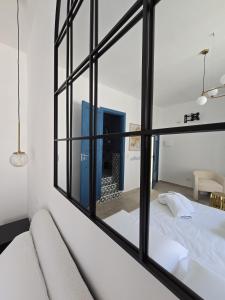 Rúm í herbergi á Terra Muronis Hotel Diffuso