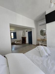 Rúm í herbergi á Terra Muronis Hotel Diffuso