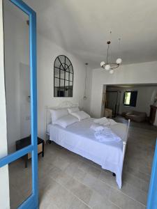 Rúm í herbergi á Terra Muronis Hotel Diffuso