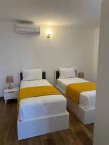 Postel nebo postele na pokoji v ubytování Treva Hotel & Apartaments