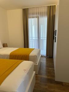 Postel nebo postele na pokoji v ubytování Treva Hotel & Apartaments