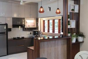 a kitchen with a counter top in a room at Chakkaly villa in Vayittiri