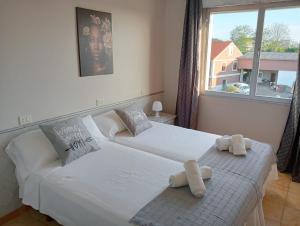 Postel nebo postele na pokoji v ubytování CASA PORTELA APARTAMENTOS