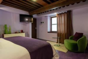 TV a/nebo společenská místnost v ubytování 1850 Hotel Boutique