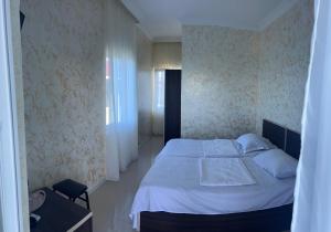 Una cama o camas en una habitación de Inn David