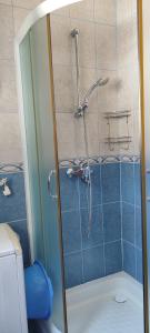 a shower with a glass door in a bathroom at Sea and Sunshine 100m to beach,free parking,centar,View in Tivat +103 photos