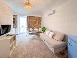 TV a/nebo společenská místnost v ubytování IBLA Luxury Suite