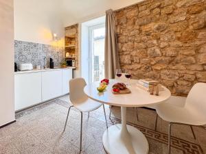 Kuchyň nebo kuchyňský kout v ubytování IBLA Luxury Suite