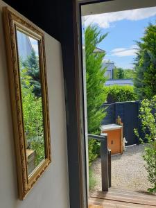 a mirror hanging on a wall next to a door at I have a dream in Colmar