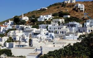 a group of white buildings on a hill at Giagermos House in Dhió Kkhoriá