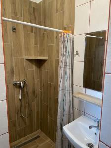 a bathroom with a shower and a sink at Fala in Karwia +88 photos