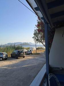 a group of cars parked in a parking lot at Dimitris Guesthouse in Kapótidhes