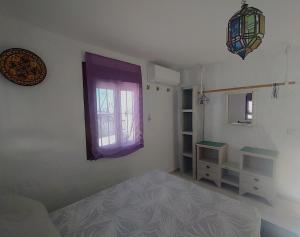 Ένα ή περισσότερα κρεβάτια σε δωμάτιο στο Casa Velazquez con terraza privada