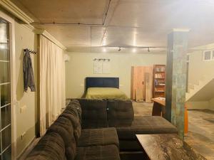 a living room with a couch and a bed at Sweet Lemon in Batumi +24 photos