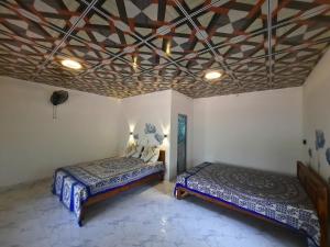 Letto o letti in una camera di Batu's Safari lodge Udawalawe