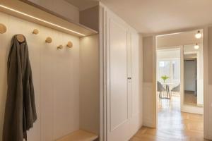 a room with a closet and a hallway with a table at Meliti Apartment in Plaka in Athens +13 photos