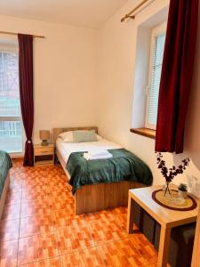 Postel nebo postele na pokoji v ubytování Hřensko 27 Apartmány