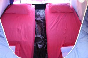 an inside view of a tent with pink inside at Camping - Ecohospedagem Canto da da Coruja - traga seu equipamento de camping in Sao Jorge +78 photos