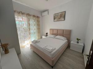 Postel nebo postele na pokoji v ubytování Dadaj Apartments