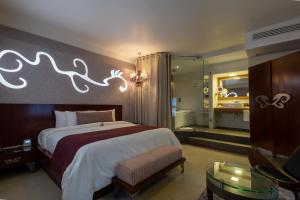 Postel nebo postele na pokoji v ubytování 1850 Hotel Boutique