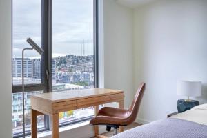 a bedroom with a desk in front of a window at South Lake Union 2br w gym roof nr downtown SEA-635 in Seattle