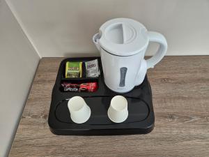 a blender sitting on top of a table at SEAPOINT Boutique Hotel in Eforie Sud