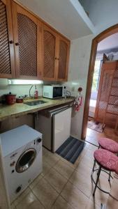 Η κουζίνα ή μικρή κουζίνα στο Loft charmoso com área de lazer