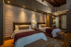 Postel nebo postele na pokoji v ubytování 1850 Hotel Boutique