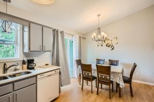 a kitchen and dining room with a table and chairs at 4bd Central Location - Patio - Games in Ramsey