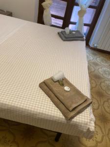 a close up of a bed with two towels on it at La stalla in Magione +6 photos