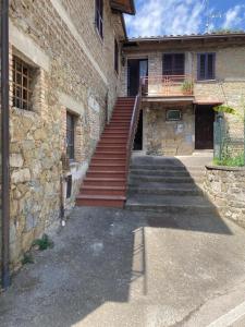 a set of stairs leading up to a building at La stalla in Magione