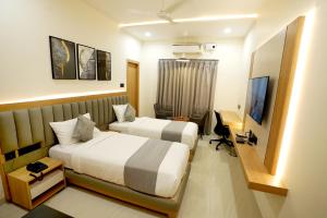 TV a/nebo společenská místnost v ubytování Oak Business Hotel