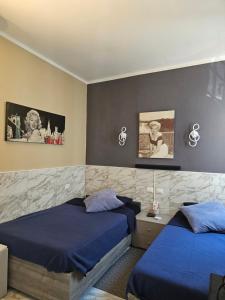 Postel nebo postele na pokoji v ubytování AURY HOME -Corso XX Settembre