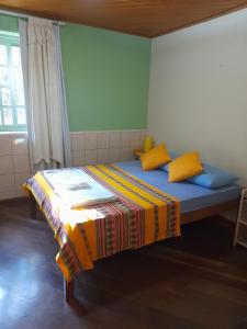 Ένα ή περισσότερα κρεβάτια σε δωμάτιο στο Itaipava Hostel