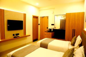 TV a/nebo společenská místnost v ubytování Oak Business Hotel