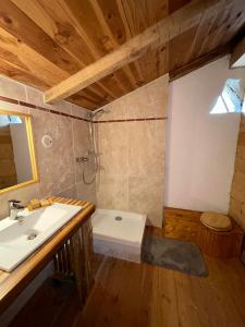 a bathroom with a sink and a toilet in it at Le Mas du Savel in Gagnières +18 photos