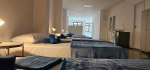 En eller flere senge i et værelse på Estudio Andrea Las Palmas