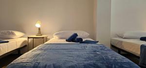 En eller flere senge i et værelse på Estudio Andrea Las Palmas