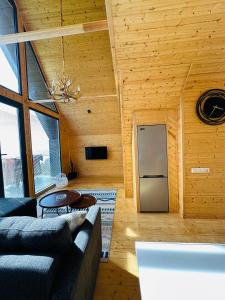 a living room with a couch and a table at Cottage KOLKHA in Sarpi +32 photos