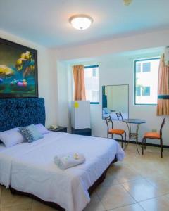 Voodi või voodid majutusasutuse Hotel Presidente Beach Salinas toas
