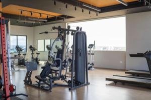 a gym with several treadmills and tread machines at Oakley Apartment- By Tito Homes in Nairobi