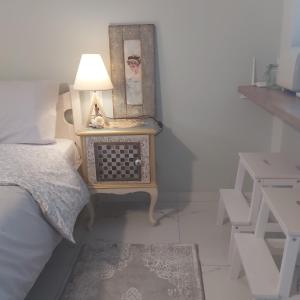 A bed or beds in a room at Eytyhias Yard apartments in Poros