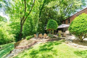 a backyard with chairs and a gazebo at Honky Tonk Home Bar, Minutes to Airport & Broadway in Nashville