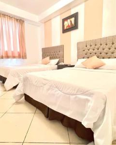 Voodi või voodid majutusasutuse Hotel Presidente Beach Salinas toas