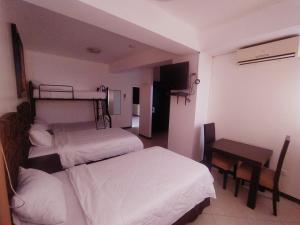 Voodi või voodid majutusasutuse Hotel Presidente Beach Salinas toas