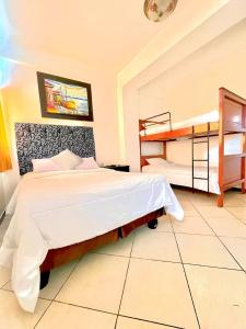 Voodi või voodid majutusasutuse Hotel Presidente Beach Salinas toas