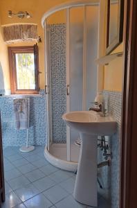 a bathroom with a sink and a shower at Casale del Principe Itri in Itri