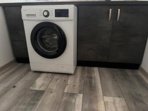 a washer and dryer sitting in a room at Sico Hostel Centru in Craiova